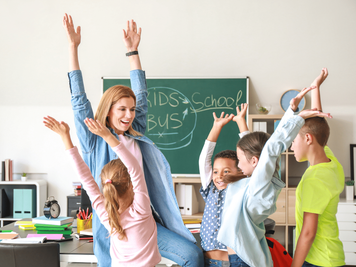 teachers and students celebrating positive behaviors in classroom